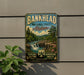 A vintage-style metal sign for the Bankhead National Forest in Alabama, featuring a scenic landscape with a waterfall and pine trees.