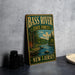 A vintage-style metal sign for Bass River State Forest in New Jersey, featuring a scenic illustration of a river surrounded by trees and mountains.