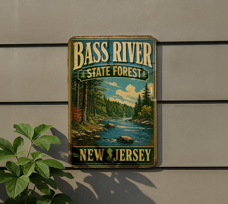 A vintage-style metal sign for Bass River State Forest in New Jersey, featuring a scenic image of a river surrounded by trees and mountains.