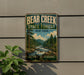 A vintage-style metal sign for Bear Creek State Forest in New York, featuring a scenic landscape with a river and pine trees.
