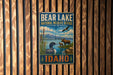 A vintage metal sign for the Bear Lake National Wildlife Refuge in Idaho, featuring an illustration of wildlife in the area.