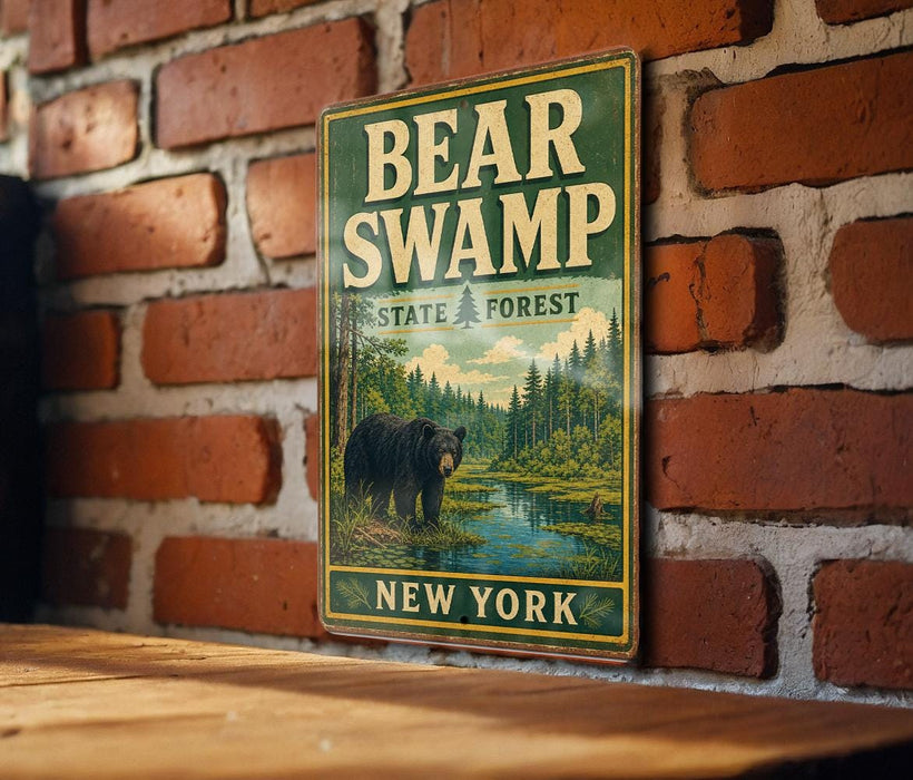 A vintage metal sign for Bear Swamp State Forest in New York, featuring a bear in a forest setting.