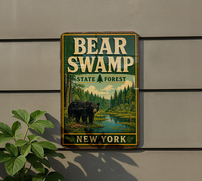 A vintage-style metal sign for Bear Swamp State Forest in New York, featuring a bear in a forest setting.