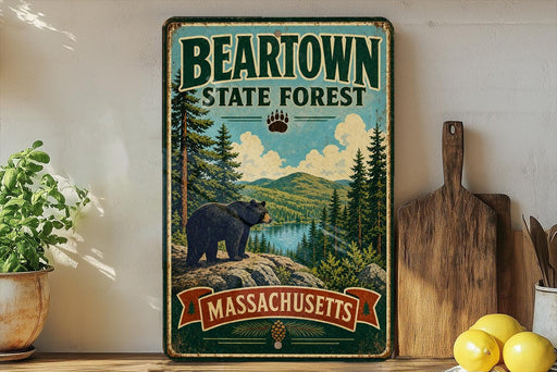 A vintage metal sign for the Beartown State Forest in Massachusetts, featuring a bear in a forest setting.