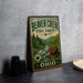A vintage-style sign for Beaver Creek State Forest in Ohio, featuring a beaver in a forest setting.