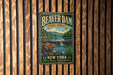 A vintage metal sign for Beaver Dam State Forest in New York, featuring an illustration of a beaver in a dam surrounded by a forest landscape.