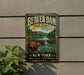 A vintage-style metal sign for Beaver Dam State Forest in New York, featuring a beaver in a forest setting and a waterfall.