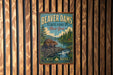 A vintage-style metal sign for Beaver Dam State Forest in New York, featuring an illustration of a beaver and a scenic landscape.