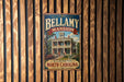 A vintage-style sign for Bellamy mansion in Winston-Salem, North Carolina, featuring an illustration of the mansion and the text "Bellamy mansion" prominently displayed.
