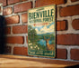 A vintage-style metal sign for the Bienville National Forest in Mississippi, featuring an illustration of a deer in a forest setting.