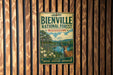A vintage-style metal sign for the Bienville National Forest in Mississippi, featuring a deer and a scenic landscape.