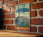 A vintage-style metal sign for the Bitter Lake National Wildlife Refuge in New Mexico, featuring an illustration of a heron and ducks in a natural setting.