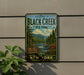 a sign that reads "Welcome to Black Creek State Forest" with a scenic illustration of a forest and a river.