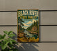 A vintage-style metal sign for the Black River State Forest in Wisconsin, featuring a scenic illustration of a river surrounded by pine trees and mountains.