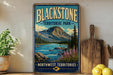 A vintage-style sign for Blackstone Territorial Park, featuring a scenic mountain landscape with a river and pine trees.