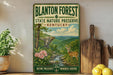 A vintage-style metal sign for Blanton Forest State Nature Preserve in Kentucky, featuring a scenic illustration of a forest, a deer, and a waterfall.
