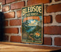 A vintage-style metal sign for the Bledsoe State Forest in Tennessee, featuring a scenic landscape with pine trees, a river, and mountains.