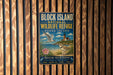 A vintage metal sign for the Block Island National Wildlife Refuge in Rhode Island, featuring a seagull, lighthouse, and coastal plants, mounted on a wooden wall.