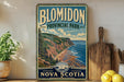 A vintage-style metal sign for Blomidon Provincial Park in Nova Scotia, featuring a scenic coastal landscape with cliffs, trees, and a ship.