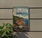 A vintage-style sign for Blomidon Provincial Park in Nova Scotia, featuring a scenic coastal landscape with cliffs and a beach.