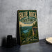 A vintage-style metal sign for Blue Rock State Forest, Ohio, featuring a scenic landscape with a lake and mountains.