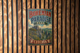 A vintage-style sign for Bohemian Paradise Park in Czechia, featuring a scenic landscape with mountains and trees.