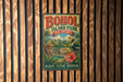 A vintage-style metal sign for BOHOL ISLAND PARK, Philippines, featuring a tropical landscape with palm trees, mountains, and a bird.