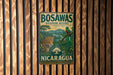 A vintage metal sign for Bosawas Biosphere Reserve in Nicaragua, featuring a jaguar and a bird in a lush, tropical landscape.
