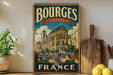 A vintage-style metal sign displaying the name 'BOURGES CATHEDRAL FRANCE' with an illustration of a cathedral in the background.