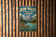 A vintage metal sign for Bow Valley Provincial Park, Alberta, featuring a scenic mountain landscape with a river and pine trees.
