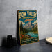 A vintage-style metal sign for Bow Valley Provincial Park, Alberta, featuring a scenic mountain landscape with a river and pine trees.