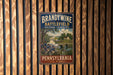 A vintage metal sign with the text "BRANDYWINE BATTLESHIP" and "CULTURAL LANDSCAPE" is displayed on a wooden wall.