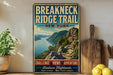 A vintage-style metal sign for the Breakneck Ridge Trail in New York, featuring a scenic mountain landscape with a river and hiking path.