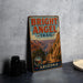 A vintage-style sign for the Bright Angel Trail in Grand Canyon National Park, Arizona, featuring a scenic mountain landscape.