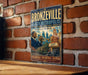 A vintage-style metal sign for the "Bronzeville Black Metropolis" in Illinois, featuring an illustration of a man playing a trumpet in front of a brick building.