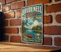 A vintage-style sign for Bridgetown River Provincial Park, featuring a scenic illustration of a canoe on the river and a forest landscape.