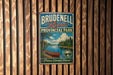 A vintage-style metal sign for Brudenzell River Provincial Park, featuring a scenic illustration of a lake, canoe, and forest landscape.