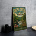 A vintage metal sign for Brush Creek State Forest in Ohio, featuring a scenic image of a waterfall surrounded by lush greenery.