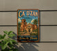 A vintage-style metal sign for the "Ca' D' Zan mansion" in Sarasota, Florida, featuring an illustration of a building with palm trees.
