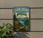 A vintage-style metal sign for Calvin Coolidge State Forest in Vermont, featuring a scenic landscape with pine trees, a lake, and mountains.