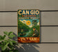 a vintage-style sign for the Can Gio Mangrove Biosphere Reserve in Vietnam, depicting a man in traditional Vietnamese attire sitting on a boat in a river surrounded by lush greenery.