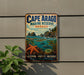 A vintage metal sign for Cape Arago Marine Reserve in Oregon, featuring a lighthouse, mountains, and marine life.