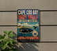 A vintage-style metal sign advertising Cape Cod Bay and the right whale critical habitat in Massachusetts.