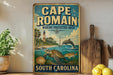 A vintage-style metal sign for Cape Romain, a marine protected area in South Carolina, featuring illustrations of marine life such as a dolphin, turtle, and fish.