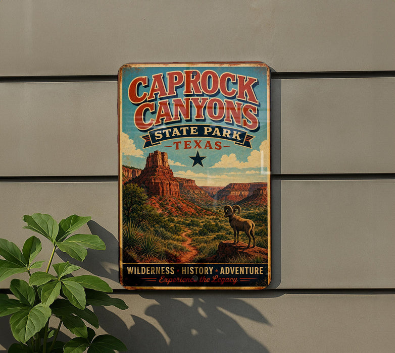A vintage metal sign for Caprock Canyon State Park in Texas, featuring a desert landscape with a bighorn sheep and the text "Wilderness, History, Adventure, Experience the Legacy".