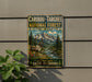 A vintage-style metal sign advertising the Caribbean-Targhee National Forest in Idaho, Wyoming, featuring a reindeer and a scenic mountain landscape.