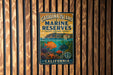 A metal sign with the text "Catalina Island Marine Reserves" and "California" is displayed on a wooden wall.