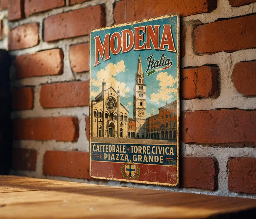 A vintage metal sign with the text "MODENA Italia" and an illustration of a church and buildings, mounted on a brick wall.