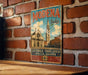 A vintage metal sign with the text "MODENA Italia" and an illustration of a church and buildings, mounted on a brick wall.