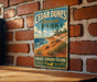 A vintage-style metal sign for Cedar Dunes Provincial Park, featuring a scenic landscape with a beach, mountains, and a lake.